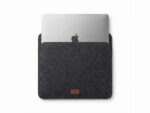 Furnotix grey felt laptop sleeve with MacBook inserted, showing snug fit.