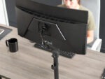 Side view of Furnotix monitor stand showing C-Clamp attachment to desk edge.